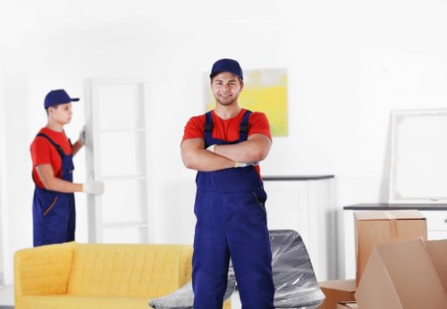 Student removals team handling boxes and furniture in Swiss Cottage
