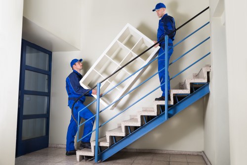Professional office relocation service packing furniture and technology in Swisscottage