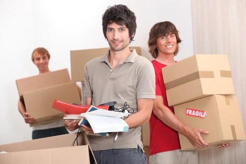 Packed boxes prepared for house removals in Swisscottage