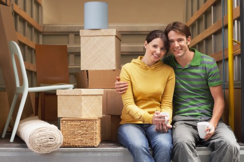 Removals team handling furniture during a local move in Swiss Cottage