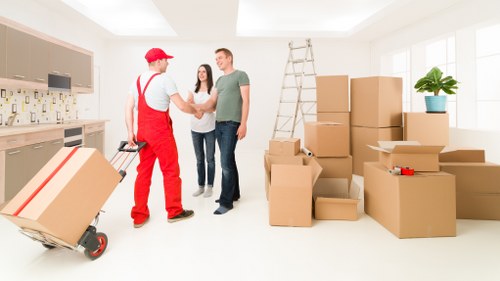 Packing and labeling boxes for a student move in Swisscottage