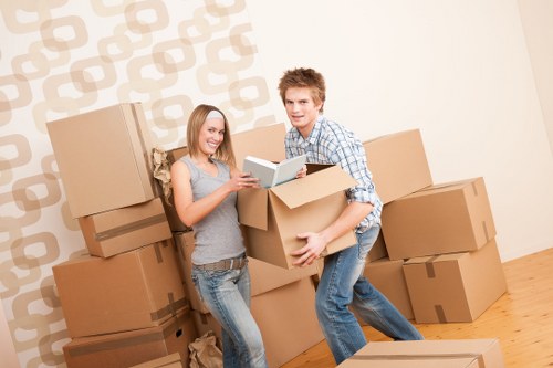 Loading household furniture into a van for transport in Swiss Cottage