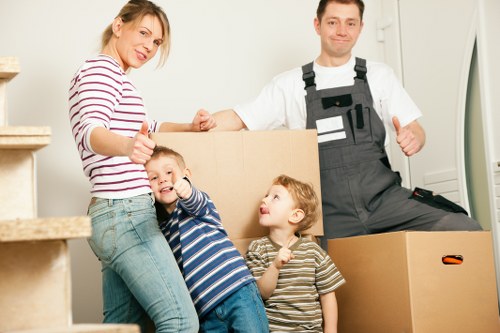 Professional moving truck helping with furniture loading in Swiss Cottage